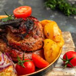 Roasted whole shoulder with potatoes, Pork leg done, German food, top view